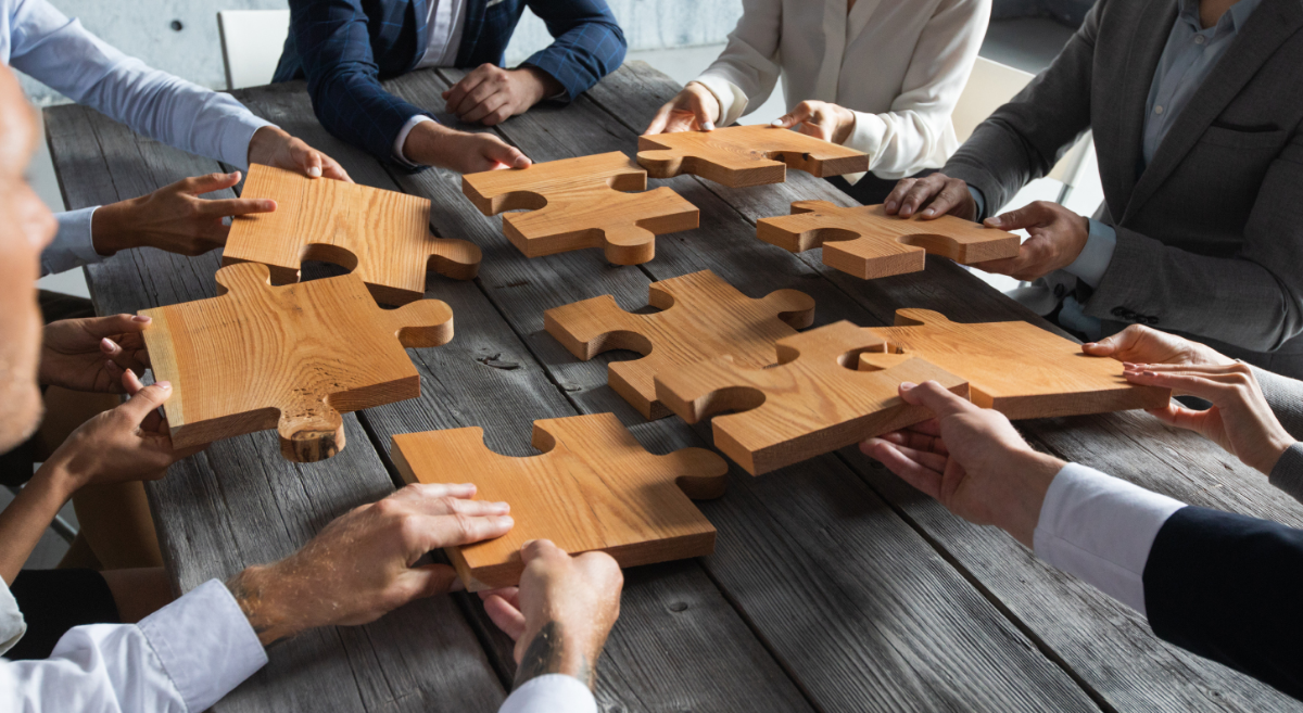 People holding puzzle pieces